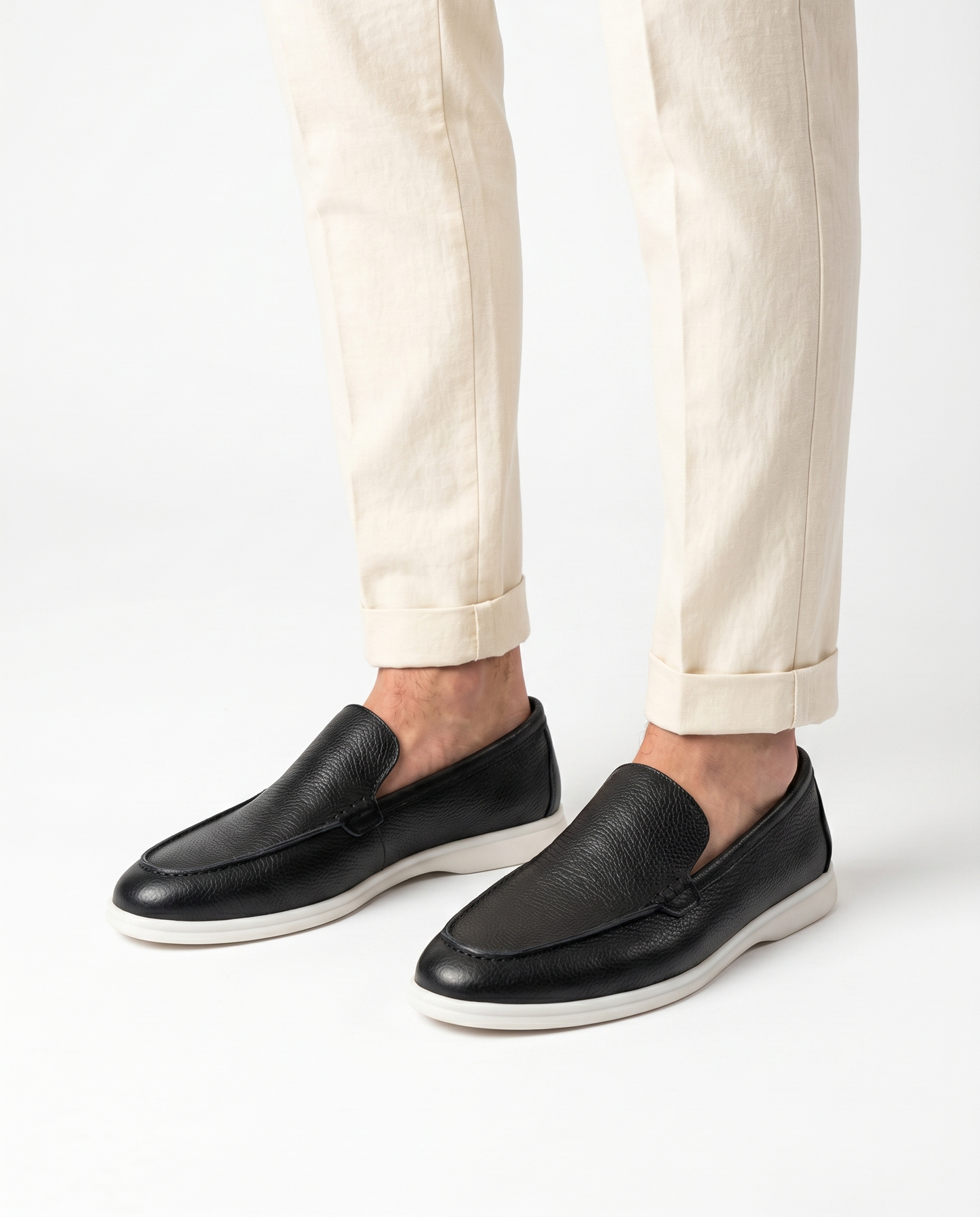 Black Kashmir leather loafer worn by model on white background