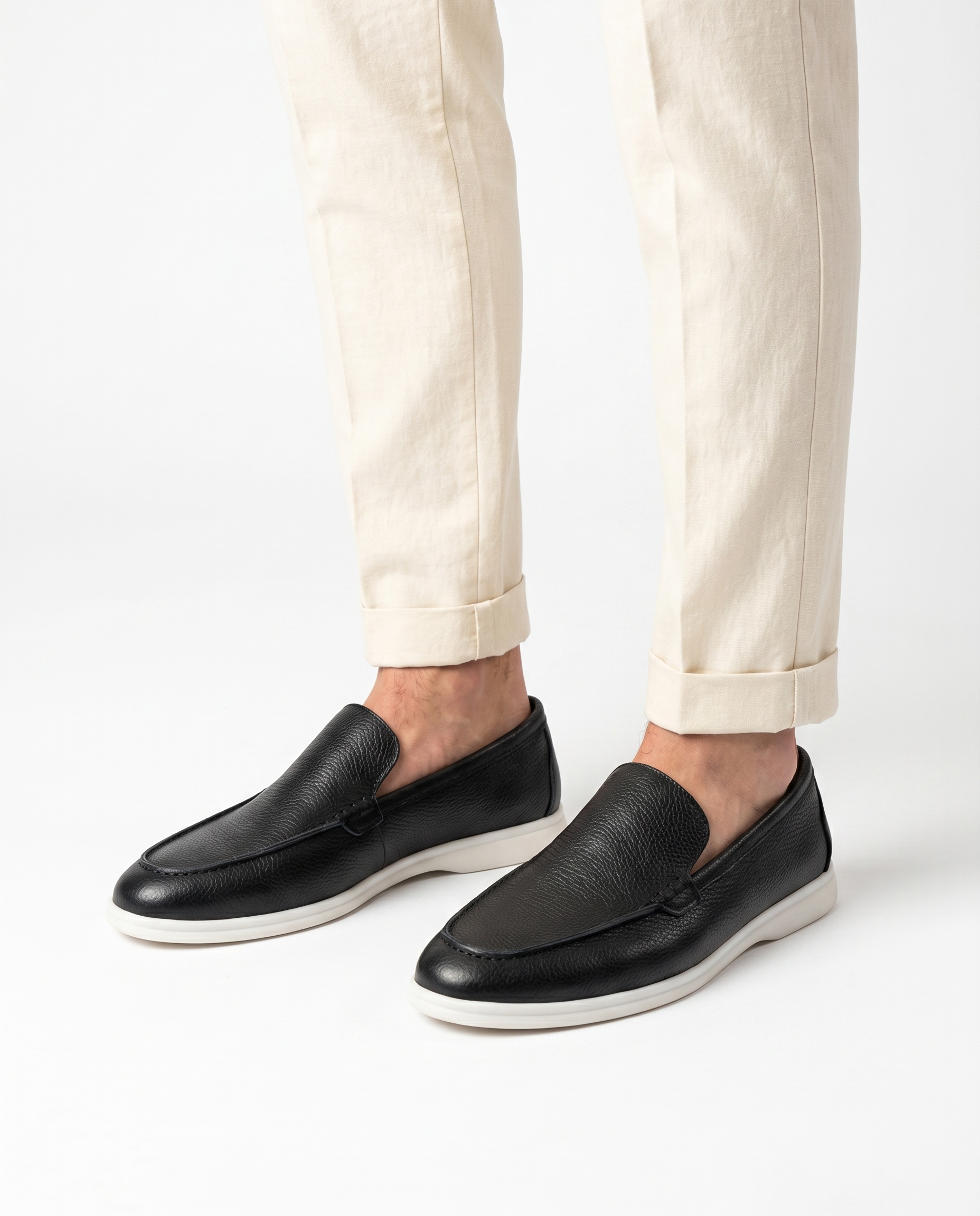 Black Kashmir leather loafer worn by model on white background